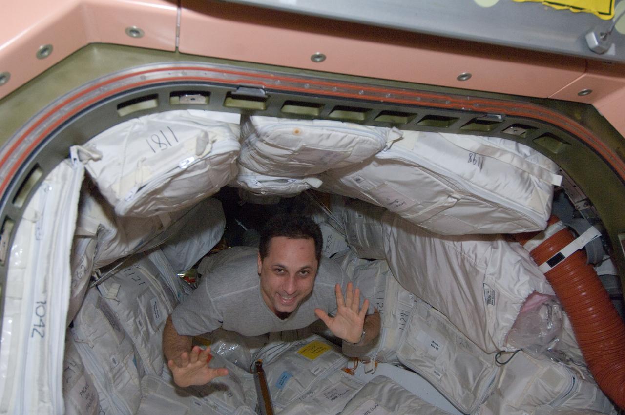 ISS030-E-033356 (27 Dec. 2011) --- Russian cosmonaut Anton Shkaplerov, Expedition 30 flight engineer, floats through a hatch into the Unity node of the International Space Station.