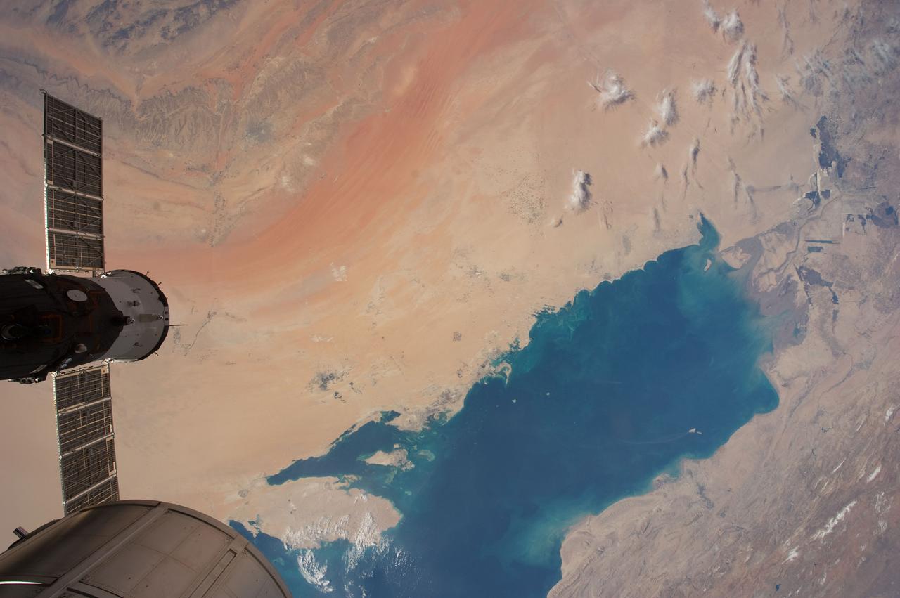 ISS030-E-035698 (30 Dec. 2011) --- This almost vertical scene of the Persian Gulf was photographed by one of the Expedition 30 crew members aboard the International Space Station on Dec. 30, 2011. A Russian spacecraft, docked to the orbital outpost, is seen at left edge of frame.