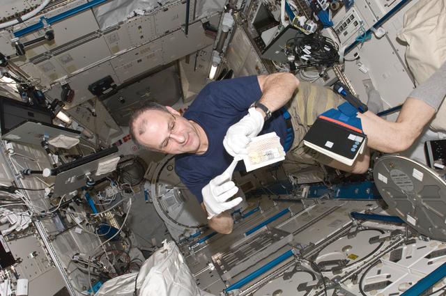 NASA image: Pettit prepares to insert biological samples in the MELFI in the JPM