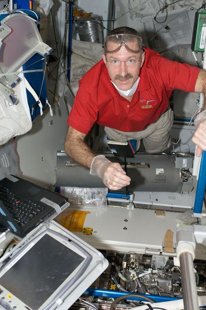 NASA image: Burbank performs in-flight maintenance on the WRS-2 in the Node 3