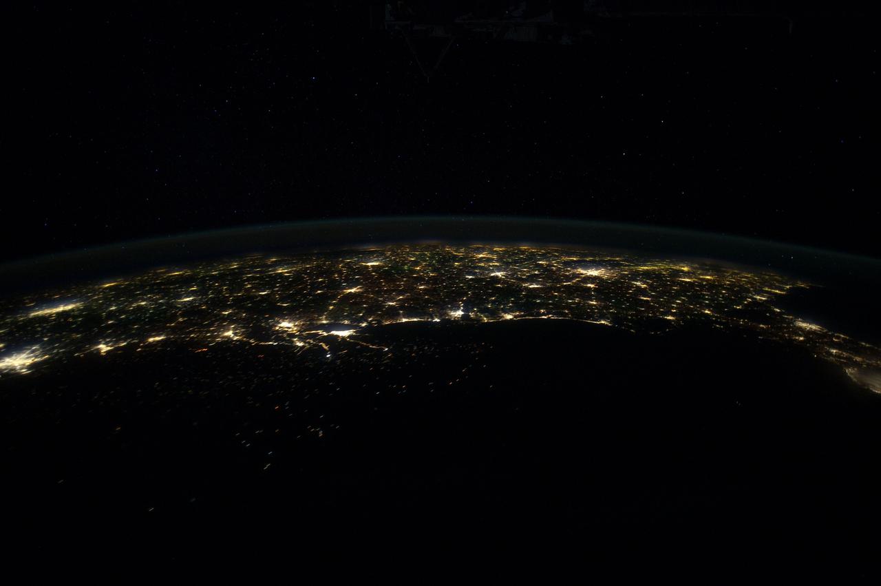 ISS030-E-055489 (29 Jan. 2012) --- This north-looking nighttime panorama of much of the land mass of the eastern two-thirds of the contiguous United States was photographed by one of the Expedition 30 crew members aboard the International Space Station as it was moving over the Gulf of Mexico on Jan. 29, 2012. In this series, the 24-mm images cover the area from the Atlantic Coast (right) to the eastern edge of the southwestern states and the western Gulf of Mexico. In this frame, Houston is near the left edge. Most of the Florida peninsula is easily recognizable at right edge. The lights of dozens of large metropolitan areas are visible.