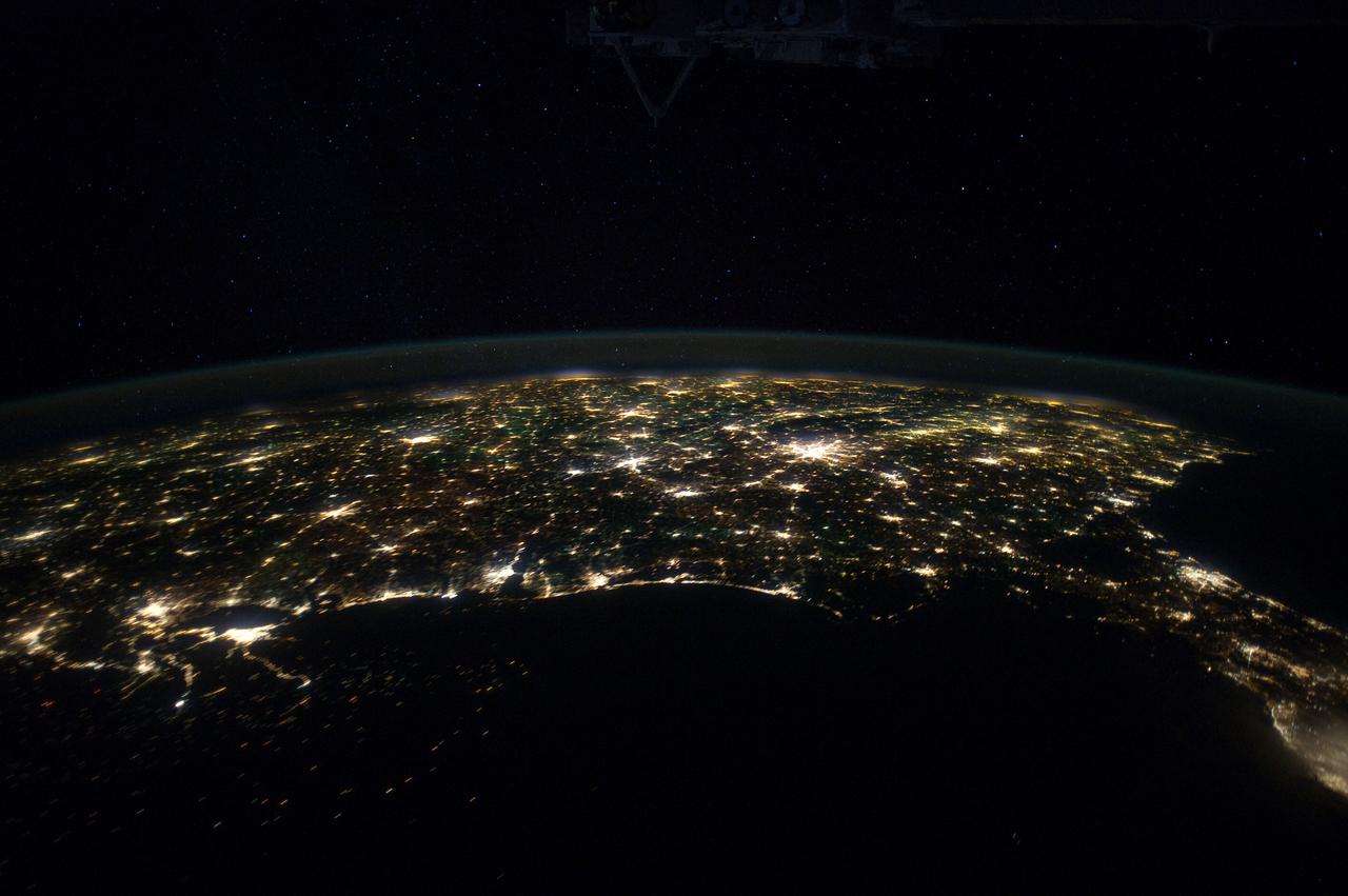 ISS030-E-055533 (29 Jan. 2012) --- This north-looking nighttime panorama of much of the land mass of the eastern two-thirds of the contiguous United States was photographed by one of the Expedition 30 crew members aboard the International Space Station as it was moving over the Gulf of Mexico on Jan. 29, 2012. In this series, the 24-mm images cover the area from the Atlantic Coast (right) to the eastern edge of the southwestern states and the western Gulf of Mexico. In this frame, Houston is near the left edge. Most of the Florida peninsula is easily recognizable at right edge. The lights of dozens of large metropolitan areas are visible.