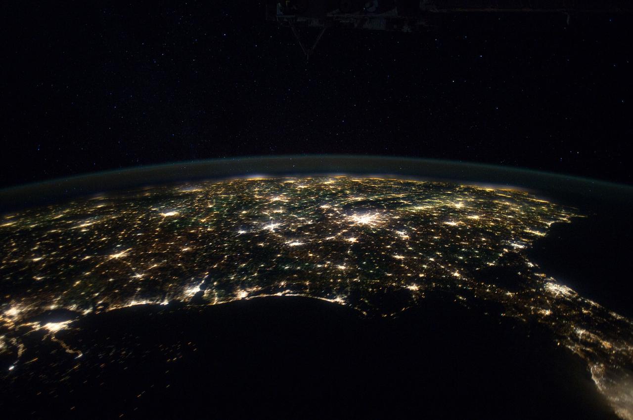 ISS030-E-055547 (29 Jan. 2012) --- This north-looking nighttime panorama of much of the land mass of the eastern two-thirds of the contiguous United States was photographed by one of the Expedition 30 crew members aboard the International Space Station as it was moving over the Gulf of Mexico on Jan. 29, 2012. In this series, the 24-mm images cover the area from the Atlantic Coast (right) to the eastern edge of the southwestern states and the western Gulf of Mexico. In this frame, Houston is near the left edge. Most of the Florida peninsula is easily recognizable at right edge. The lights of dozens of large metropolitan areas are visible.