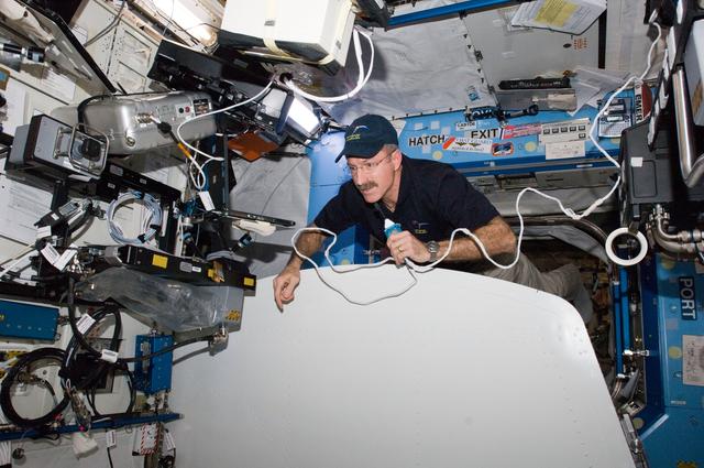 NASA image: Burbank uses communication equipment in the U.S. Laboratory