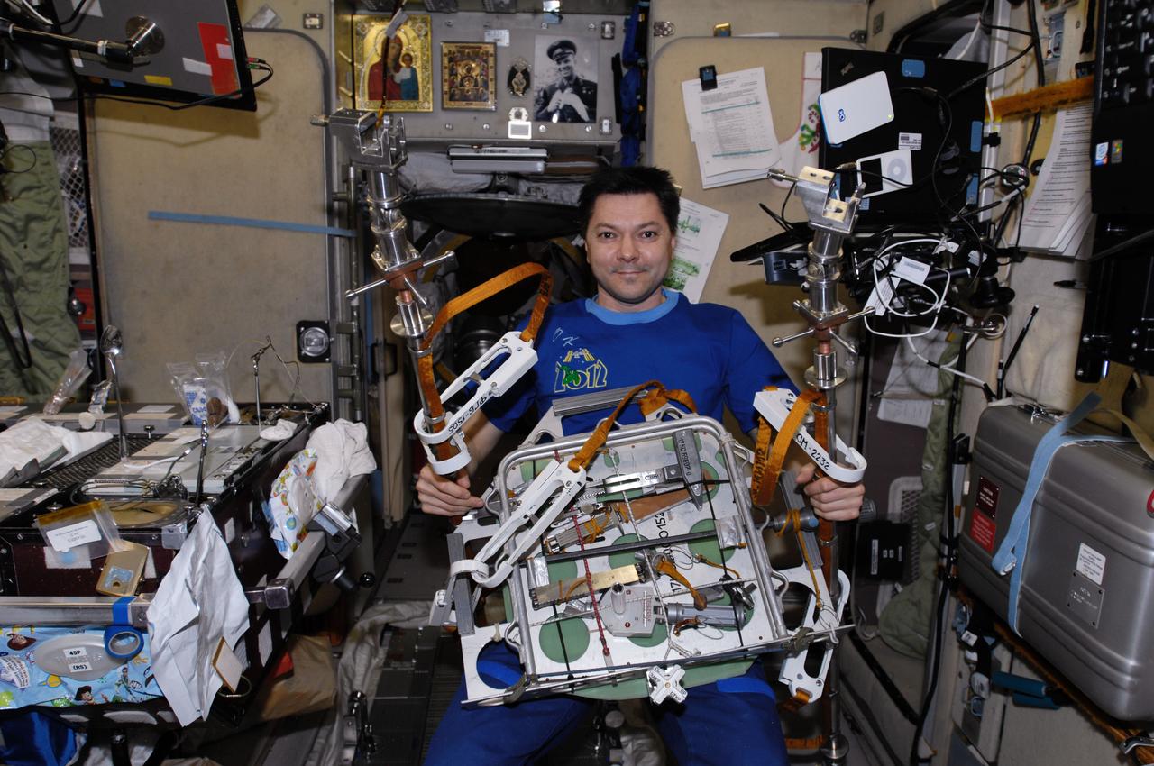 ISS030-E-061158 (3 Feb. 2012) --- Russian cosmonaut Oleg Kononenko, Expedition 30 flight engineer, works with extravehicular activity (EVA) hardware in the Zvezda Service Module of the International Space Station in preparation for an EVA scheduled for Feb. 16, 2012.