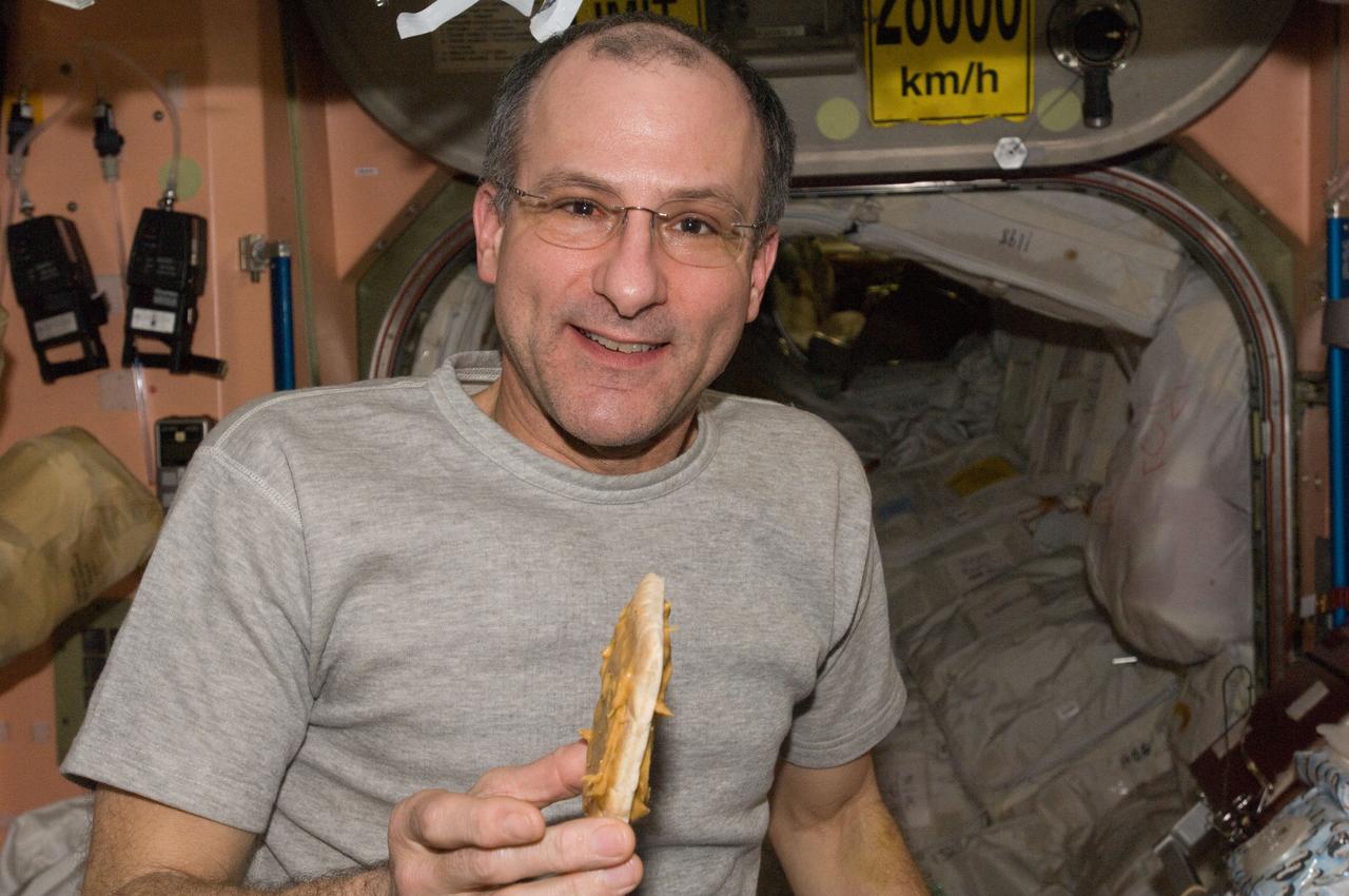 ISS030-E-063909 (6 Feb. 2012) --- NASA astronaut Don Pettit, Expedition 30 flight engineer, holds a snack in the Unity node of the International Space Station.