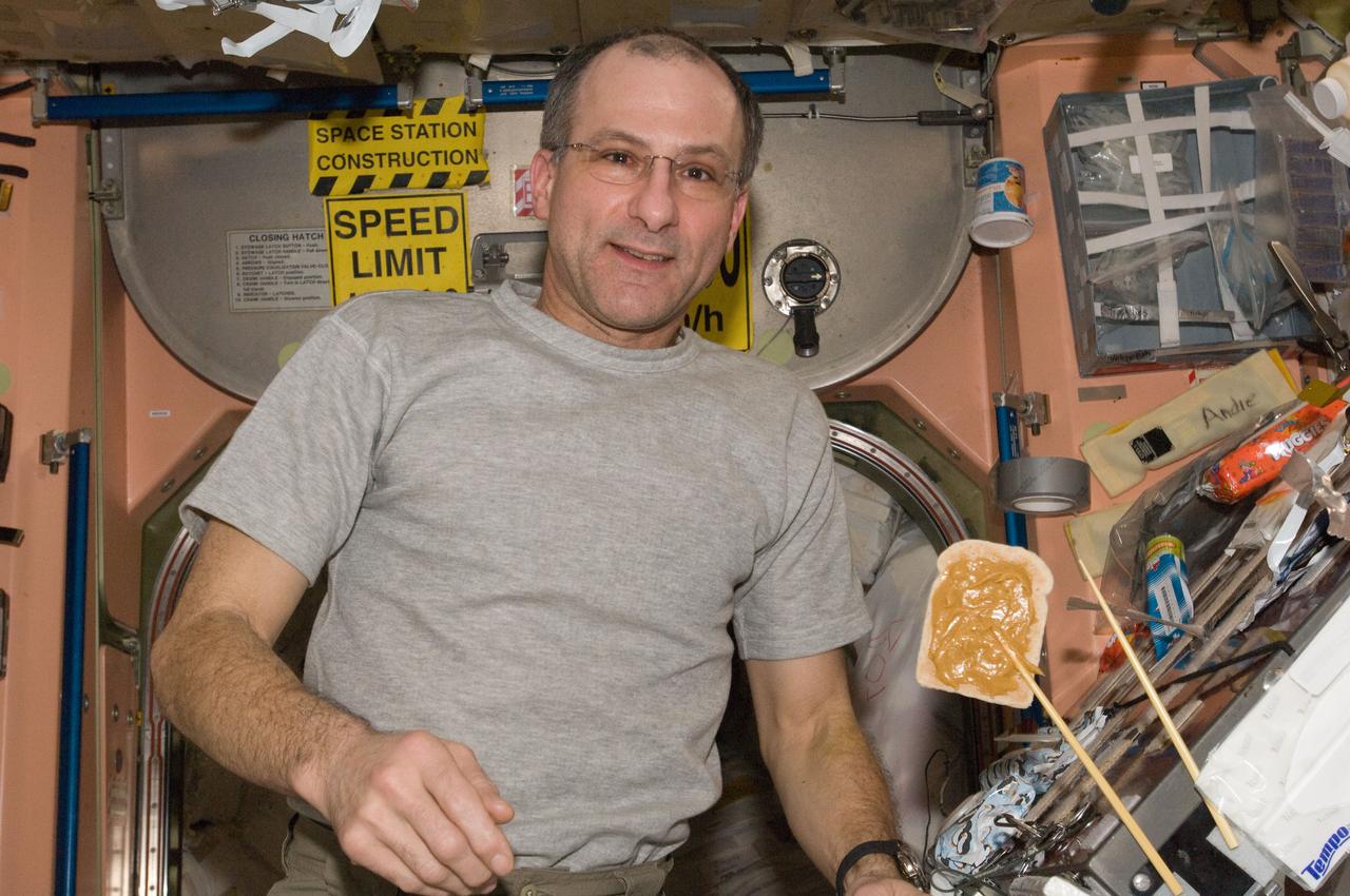 ISS030-E-063915 (6 Feb. 2012) --- NASA astronaut Don Pettit, Expedition 30 flight engineer, is pictured near a snack floating freely in the Unity node of the International Space Station.