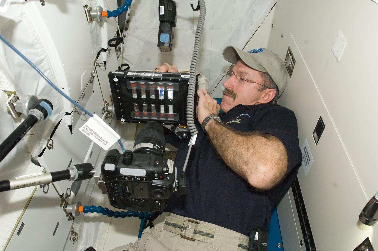 ISS030-E-063961 (8 Feb. 2012) --- NASA astronaut Dan Burbank, Expedition 30 commander, conducts a session with the Binary Colloidal Alloy Test-6 (BCAT-6) experiment in the Kibo laboratory of the International Space Station.