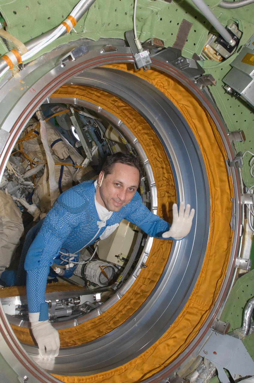 ISS030-E-078147 (16 Feb. 2012) --- In the International Space Station?s Pirs Docking Compartment, Russian cosmonaut Anton Shkaplerov, Expedition 30 flight engineer, is pictured while preparing for a session of extravehicular activity (EVA). Shkaplerov is wearing a blue thermal undergarment that complements the Russian Orlan spacesuit.