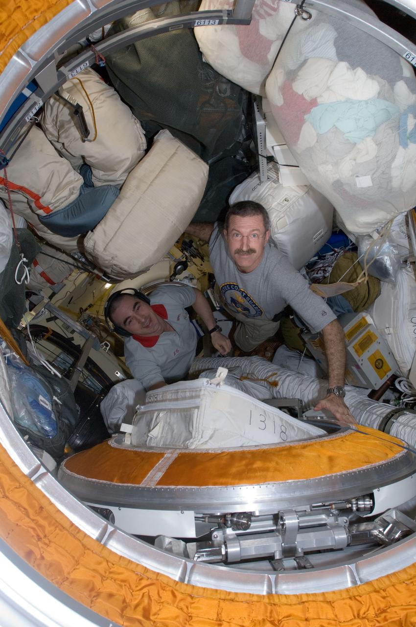 ISS030-E-078157 (16 Feb. 2012) --- NASA astronaut Dan Burbank (right), Expedition 30 commander; and Russian cosmonaut Anatoly Ivanishin, flight engineer, work in the International Space Station?s Pirs Docking Compartment as the crew prepares for a session of extravehicular activity (EVA) to continue outfitting the International Space Station.