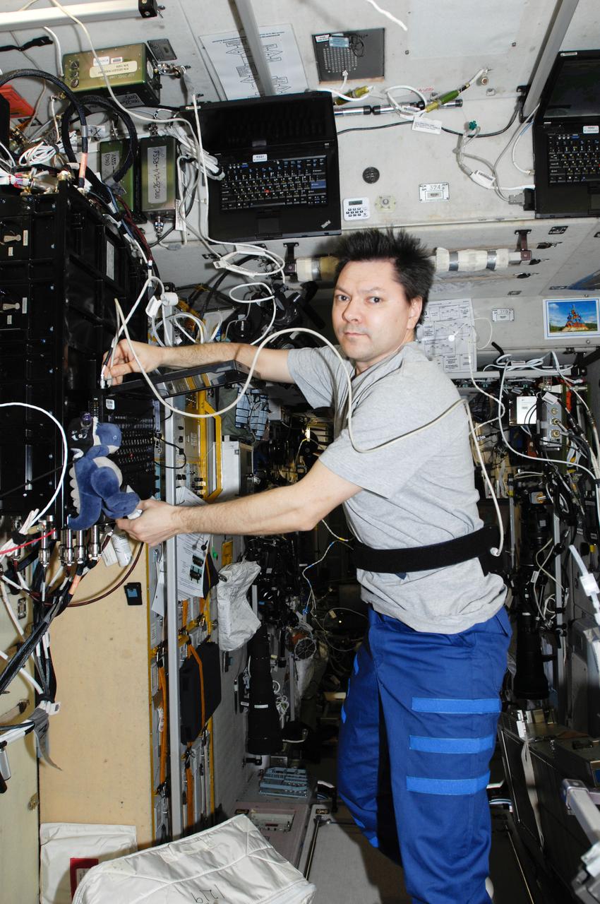 ISS030-E-093432 (23 Feb. 2012) --- Russian cosmonaut Oleg Kononenko, Expedition 30 flight engineer, performs a SPRUT-2 experiment run in the Zvezda Service Module of the International Space Station.