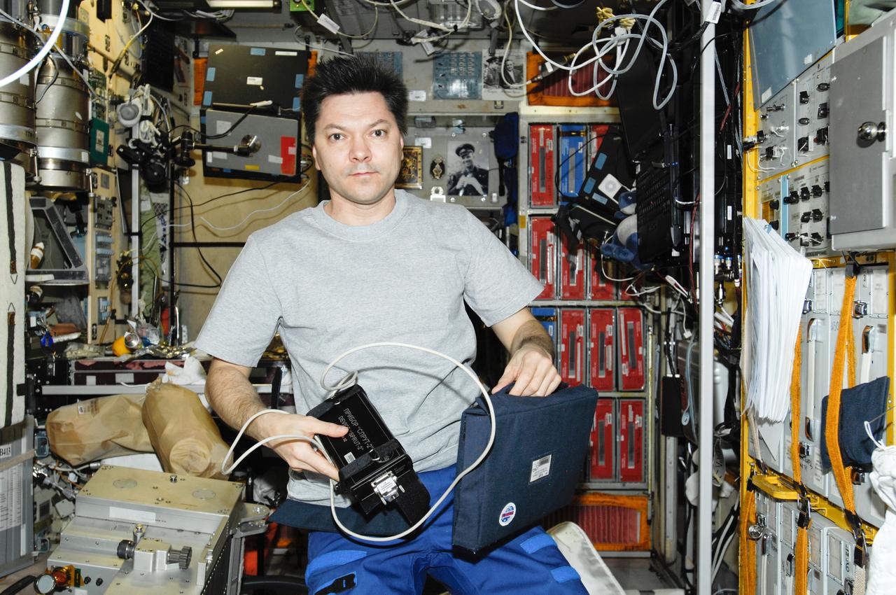 ISS030-E-093434 (23 Feb. 2012) --- Russian cosmonaut Oleg Kononenko, Expedition 30 flight engineer, performs a SPRUT-2 experiment run in the Zvezda Service Module of the International Space Station.