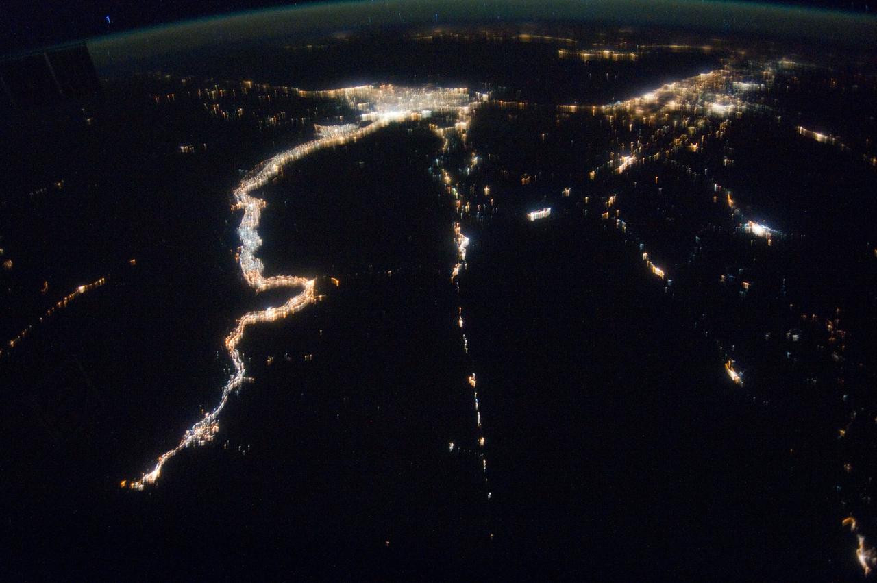 ISS030-E-112823 (25 Feb. 2012) --- This nighttime image photographed by one of the Expedition 30 crew members aboard the International Space Station provides a look toward the Mediterranean Sea. Along the left side, the night lights clearly depict the high population associated with the Nile River and its delta and the Alexandria, Egypt area (top left center). The Gulf of Suez and the Suez Canal are seen to the right.