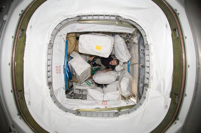 NASA image: Burbank among stowage containers in the Leonardo PMM