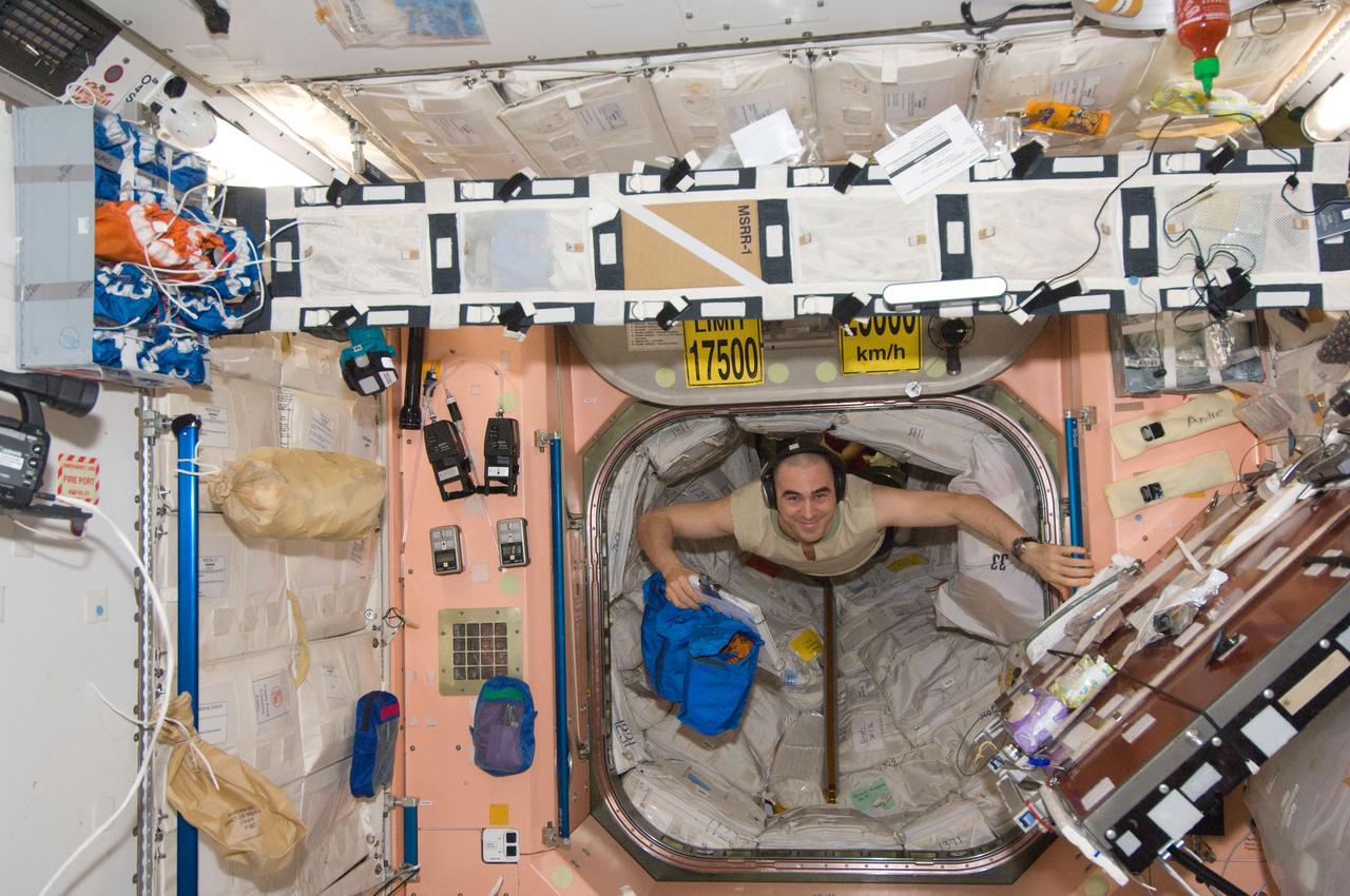 ISS030-E-117046 (12 Jan. 2012) --- Russian cosmonaut Anatoly Ivanishin, Expedition 30 flight engineer, floats into the Unity node of the International Space Station.