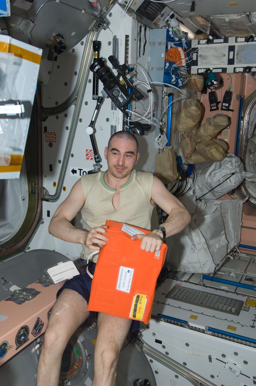 ISS030-E-117660 (8 Feb. 2012) --- Russian cosmonaut Anatoly Ivanishin, Expedition 30 flight engineer, holds an ammonia respirator kit in the Unity node of the International Space Station.