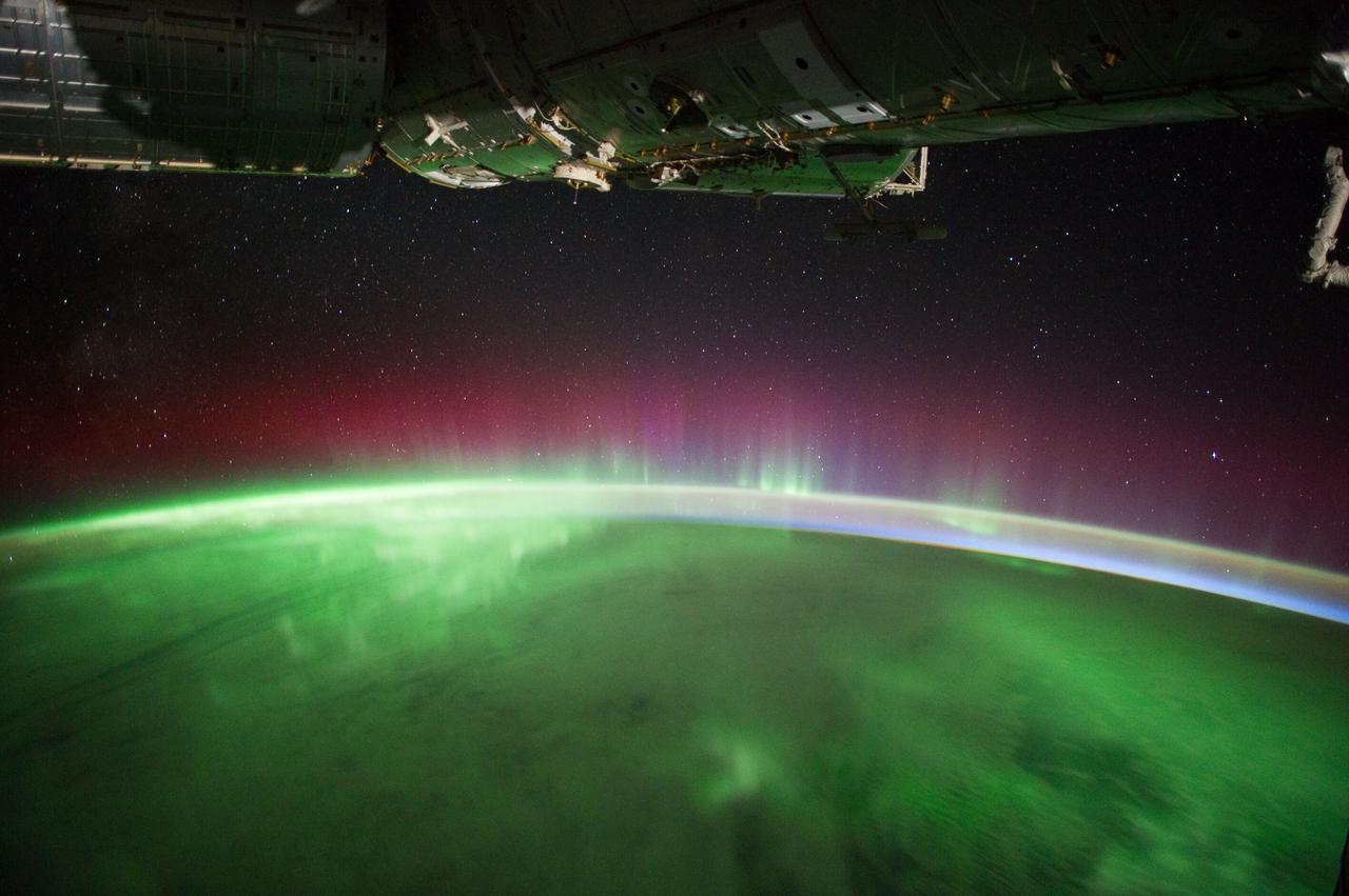 iss030e119777 (3/3/2012) --- A view of the night earth taken aboard the International Space Station (ISS) showing an aurora. An aurora sometimes referred to as polar lights, northern lights (aurora borealis), or southern lights (aurora australis), is a natural light display in the Earth's sky, predominantly seen in the high-latitude regions (around the Arctic and Antarctic). Auroras are the result of disturbances in the magnetosphere caused by solar wind.