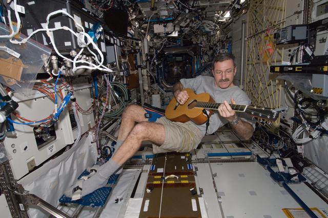 NASA image: Burbank plays guitar in the U.S. Laboratory