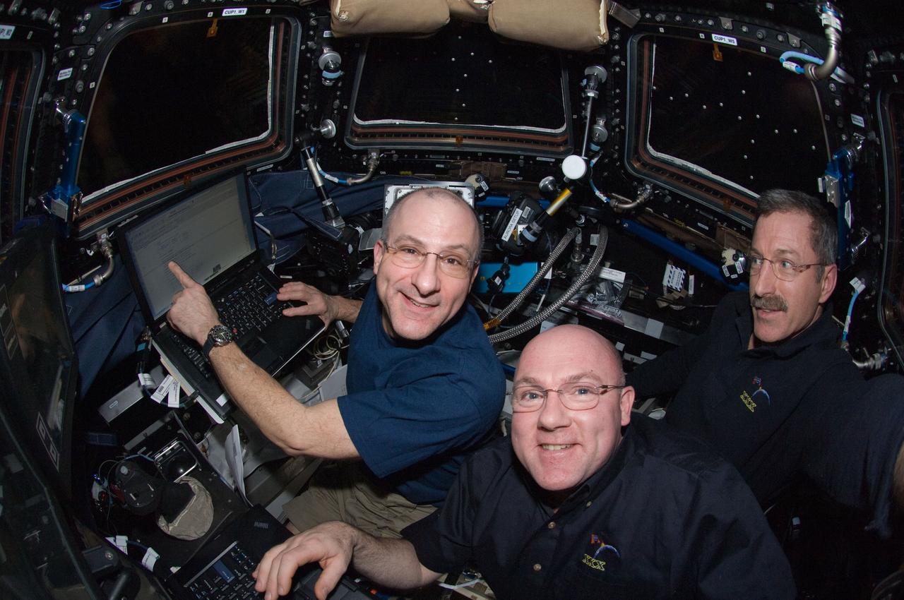 Pettit,Kuipers,and Burbank during SSRMS Maneuver in the Cupola Module