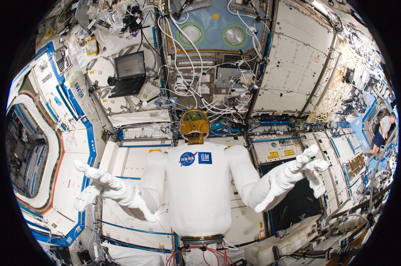 ISS030-E-135157 (13 March 2012) --- A fisheye lens attached to an electronic still camera was used to capture this image of Robonaut 2 humanoid robot during another system checkout in the Destiny laboratory of the International Space Station. Teams on the ground commanded Robonaut through a series of dexterity tests as it spelled out ?Hello world? in sign language.