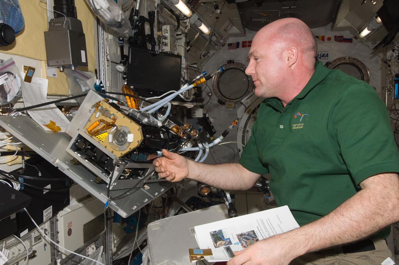 ISS030-E-142827 (15 March 2012) --- European Space Agency astronaut Andre Kuipers, Expedition 30 flight engineer, works to remove the Marangoni Surface fluid physics experiment from the Fluid Physics Experiment Facility (FPEF) in the Kibo laboratory of the International Space Station.
