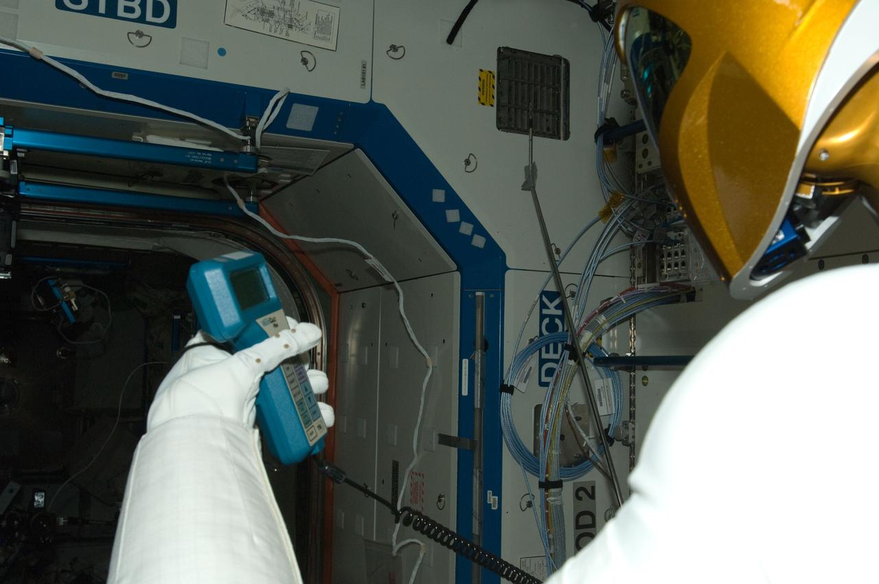 ISS030-E-142875 (14 March 2012) --- Controlled by teams on the ground, Robonaut 2 humanoid robot holds an instrument to measure air velocity during another system check out in the Destiny laboratory of the International Space Station.