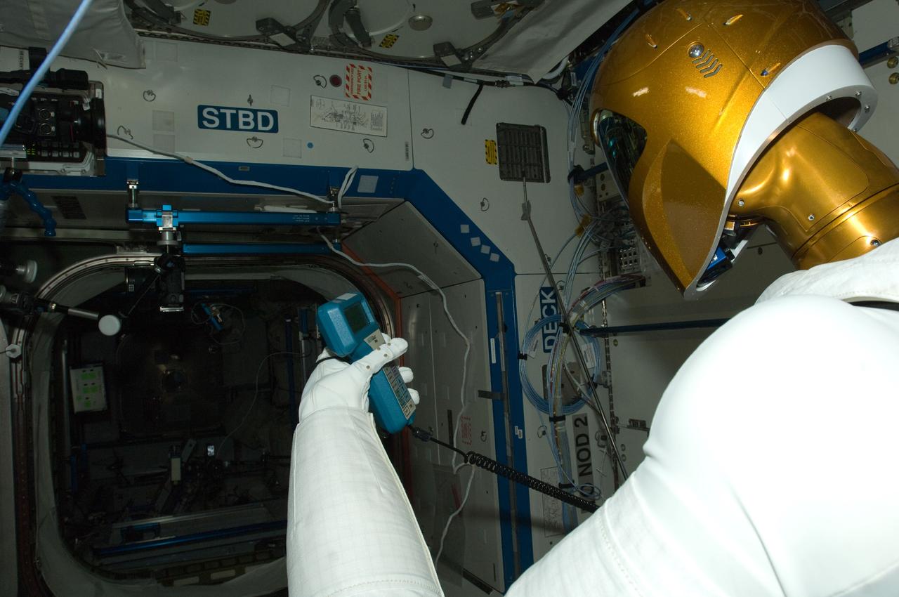 ISS030-E-142876 (14 March 2012) --- Controlled by teams on the ground, Robonaut 2 humanoid robot holds an instrument to measure air velocity during another system check out in the Destiny laboratory of the International Space Station.
