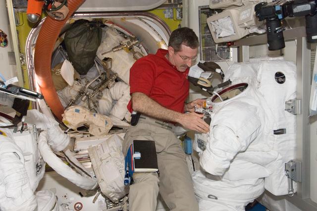 NASA image: Burbank performs routine in-flight maintenance on the EMU