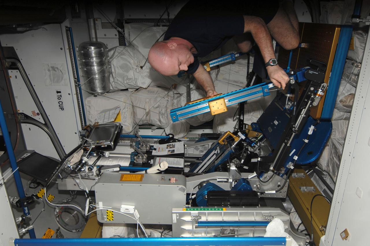 ISS030-E-148381 (22 Jan. 2012) --- European Space Agency astronaut Andre Kuipers, Expedition 30 flight engineer, prepares to exercise in the Tranquility node of the International Space Station, using the advanced Resistive Exercise Device (aRED).