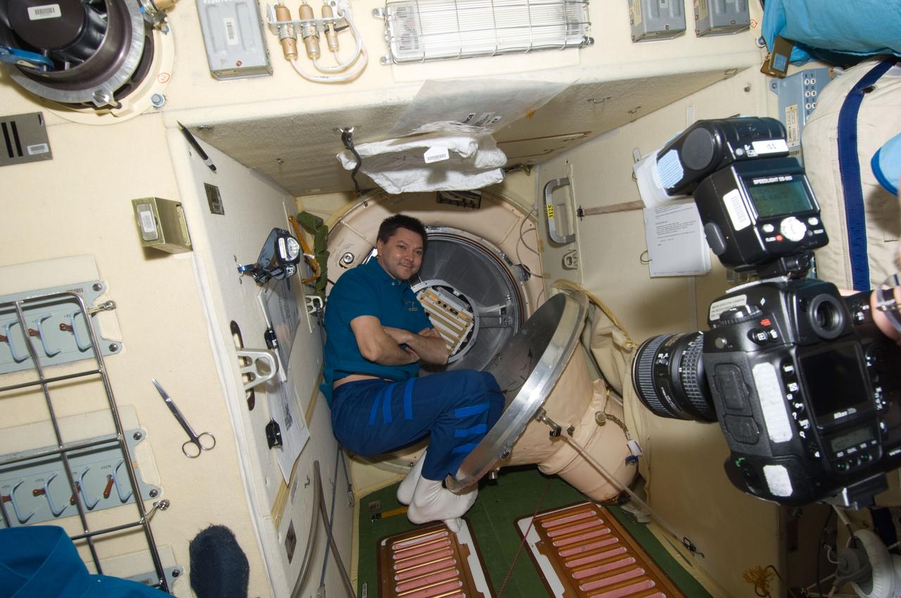 ISS030-E-155928 (19 Jan. 2012) --- Russian cosmonaut Oleg Kononenko, Expedition 30 flight engineer, is pictured near a hatch in the Pirs Docking Compartment of the International Space Station.