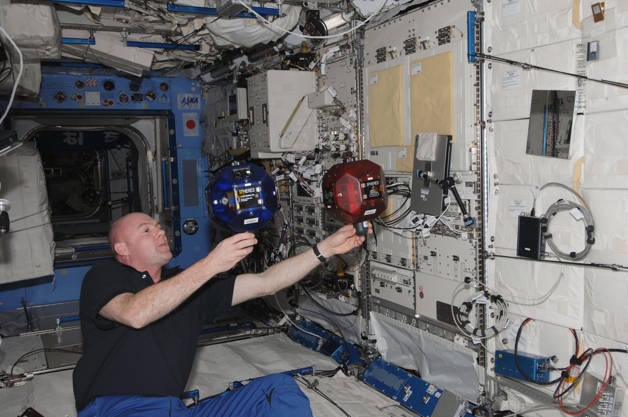 ISS030-E-156310 (23 Jan. 2012) --- European Space Agency astronaut Andre Kuipers, Expedition 30 flight engineer, works with the Synchronized Position Hold, Engage, Reorient, Experimental Satellites Zero Robotics (SPHERES ZR) experiment in the Kibo laboratory of the International Space Station.