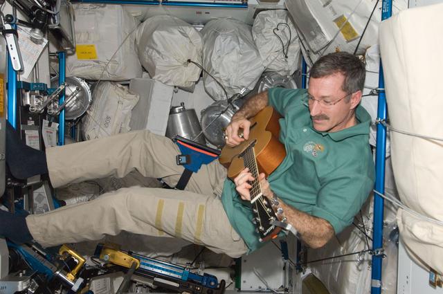 NASA image: Burbank plays guitar in the Node 3