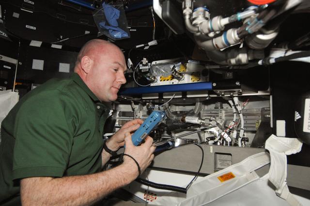 NASA image: Kuipers holds Velocicalc Meter in the Node 3