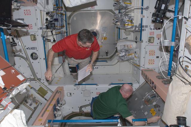 NASA image: Burbank and Kuipers review crew procedures