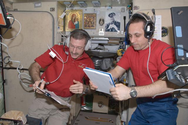 NASA image: Burbank and Shkaplerov review crew procedures