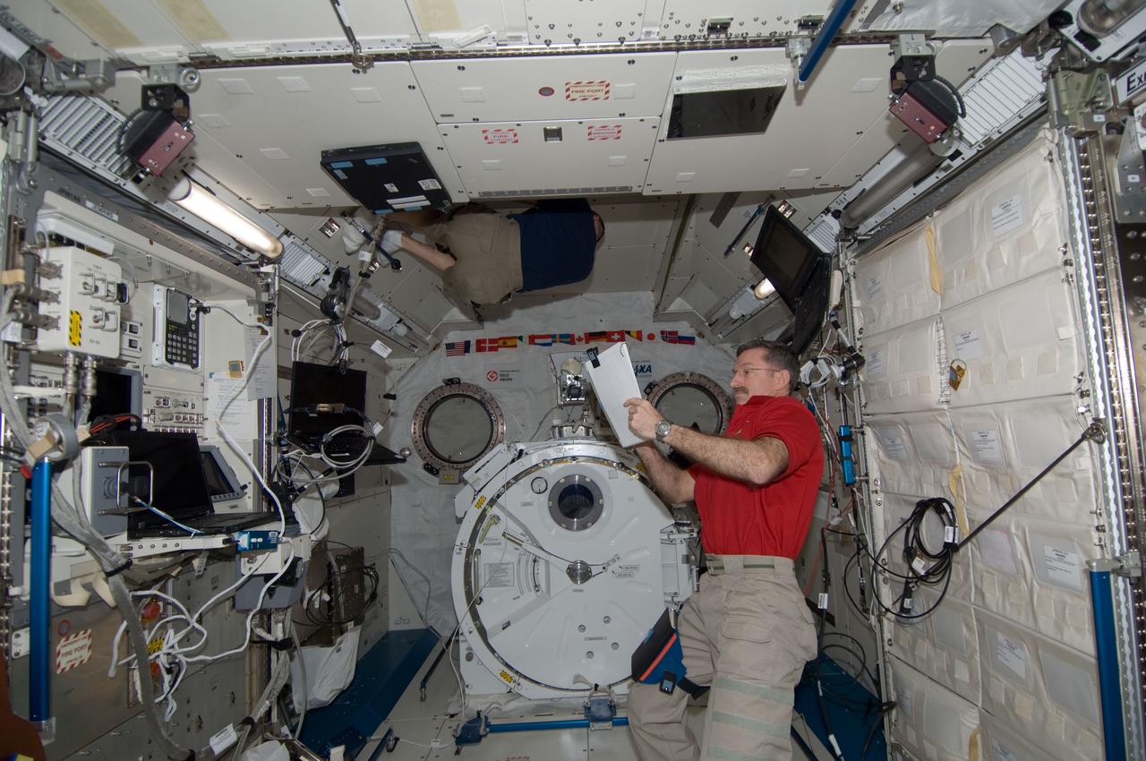 ISS030-E-173911 (24 March 2012) --- NASA astronaut Dan Burbank, Expedition 30 commander, reviews crew procedures in the Kibo laboratory of the International Space Station as crew members prepare to move to the appropriate Soyuz vehicles, due to the possibility that space debris could pass close to the station. Burbank, Shkaplerov and Ivanishin sheltered in the Soyuz TMA-22 spacecraft attached to the Poisk Mini-Research Module 2 (MRM2) while Kononenko, Kuipers and Pettit took to the Soyuz TMA-03M docked to the Rassvet Mini-Research Module 1 (MRM-1).