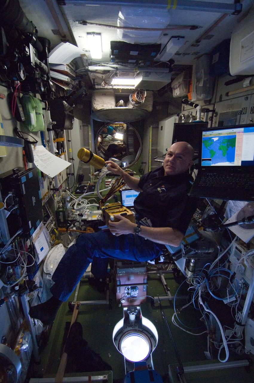 ISS030-E-177101 (12 March 2012) --- European Space Agency astronaut Andre Kuipers, Expedition 30 flight engineer, sets up the Environmental Health System / Tissue Equivalent Proportional Counter (EHS/TEPC) spectrometer and detector assembly on panel 327 in the Zvezda Service Module of the International Space Station. The TEPC detector assembly is the primary radiation measurement tool on the space station.