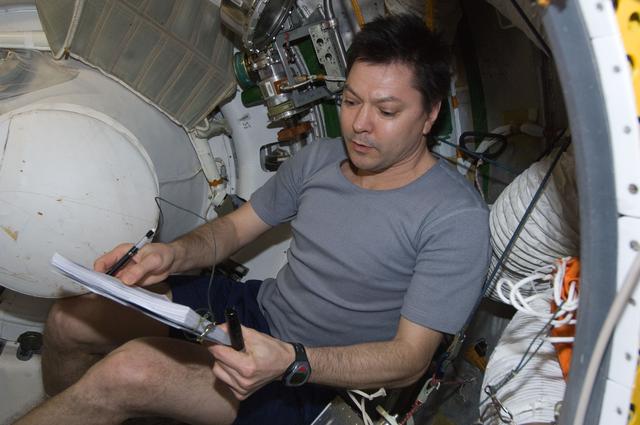 NASA image: Kononenko conducts a leak check in the SM Transfer Tunnel/ATV Vestibule