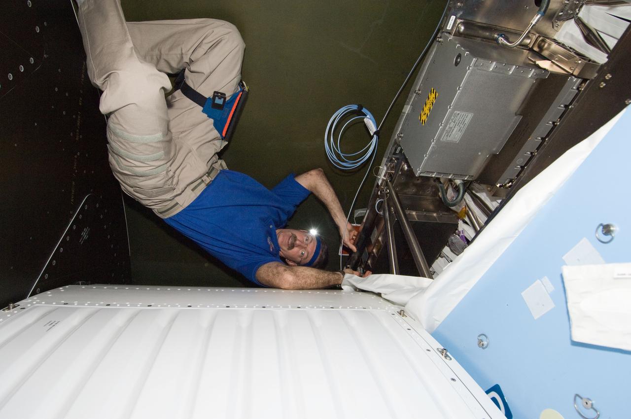 ISS030-E-195109 (4 April 2012) --- NASA astronaut Dan Burbank, Expedition 30 commander, works on the Multiplexer / Demultiplexer (MDM) 16C Assembly in the Destiny laboratory of the International Space Station.