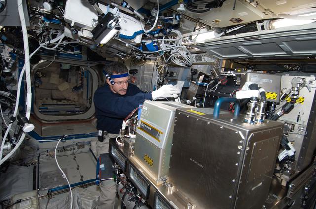 NASA image: Burbank works on the CIR in the U.S. Laboratory