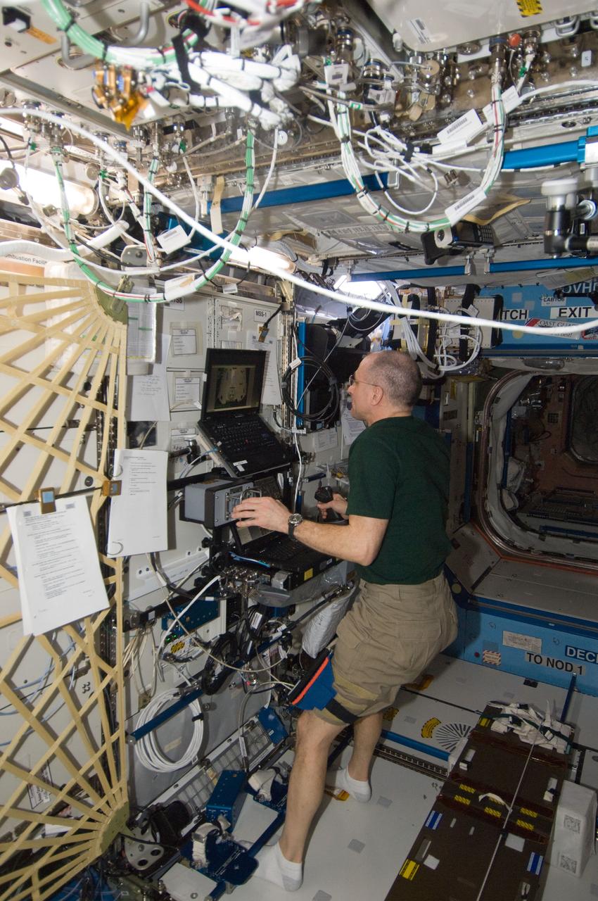 ISS030-E-235581 (11 April 2012) --- In the International Space Station’s Destiny laboratory, NASA astronaut Don Pettit, Expedition 30 flight engineer, conducts the first of three sessions on the ROBoT simulator in preparation for the arrival of the SpaceX Dragon. Slated for liftoff on April 30, 2012, at 12:22 (EDT) from the Kennedy Space Center, the goal of Dragon’s planned 21-day mission will be to test the unpiloted capsule’s ability to rendezvous with the space station.