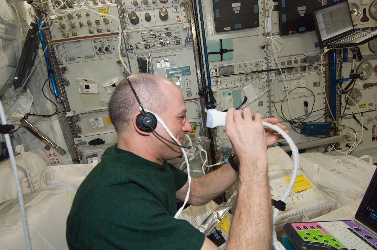 ISS030-E-235669 (12 April 2012) --- NASA astronaut Don Pettit, Expedition 30 flight engineer, performs ultrasound eye imaging in the Columbus laboratory of the International Space Station.