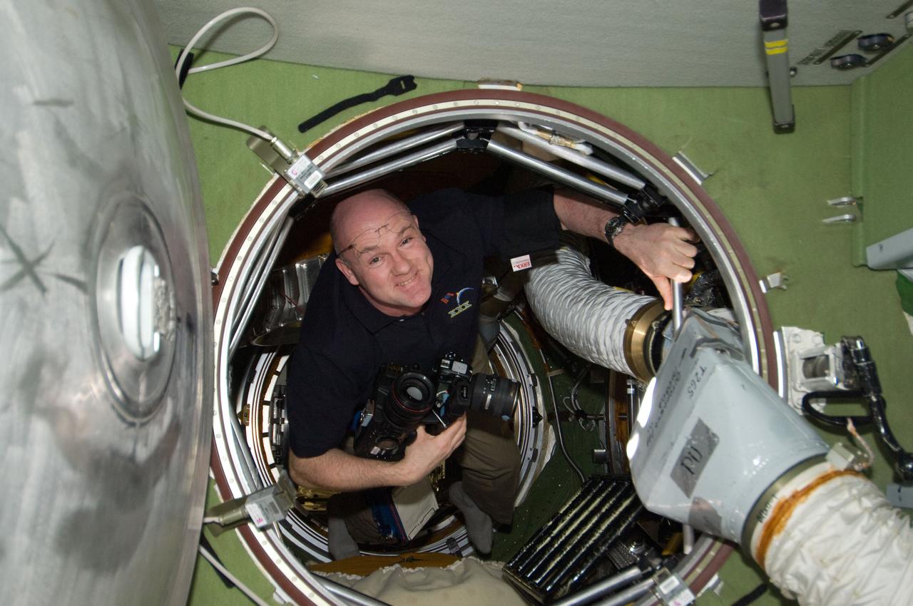 ISS030-E-238161 (19 April 2012) --- European Space Agency astronaut Andre Kuipers, Expedition 30 flight engineer, is pictured in a hatch on the International Space Station.