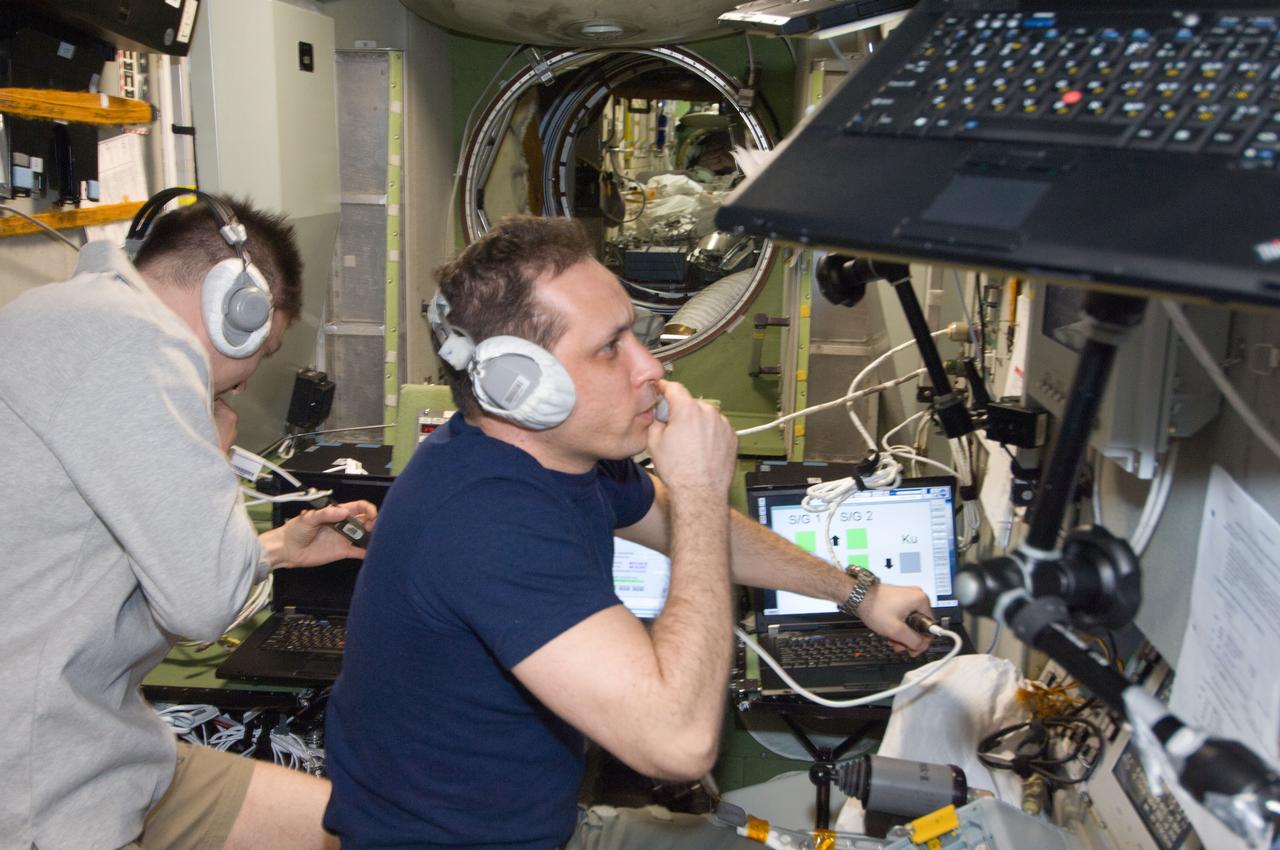 ISS030-E-241414 (22 April 2012) --- Russian cosmonauts Anton Shkaplerov (right) and Oleg Kononenko, both Expedition 30 flight engineers, monitor data at the manual TORU docking system controls in the Zvezda Service Module of the International Space Station during approach and docking operations of the unpiloted ISS Progress 47 resupply vehicle. Progress 47 docked automatically to the Pirs Docking Compartment via the Kurs automated rendezvous system at 10:39 a.m. (EDT) on April 22, 2012.