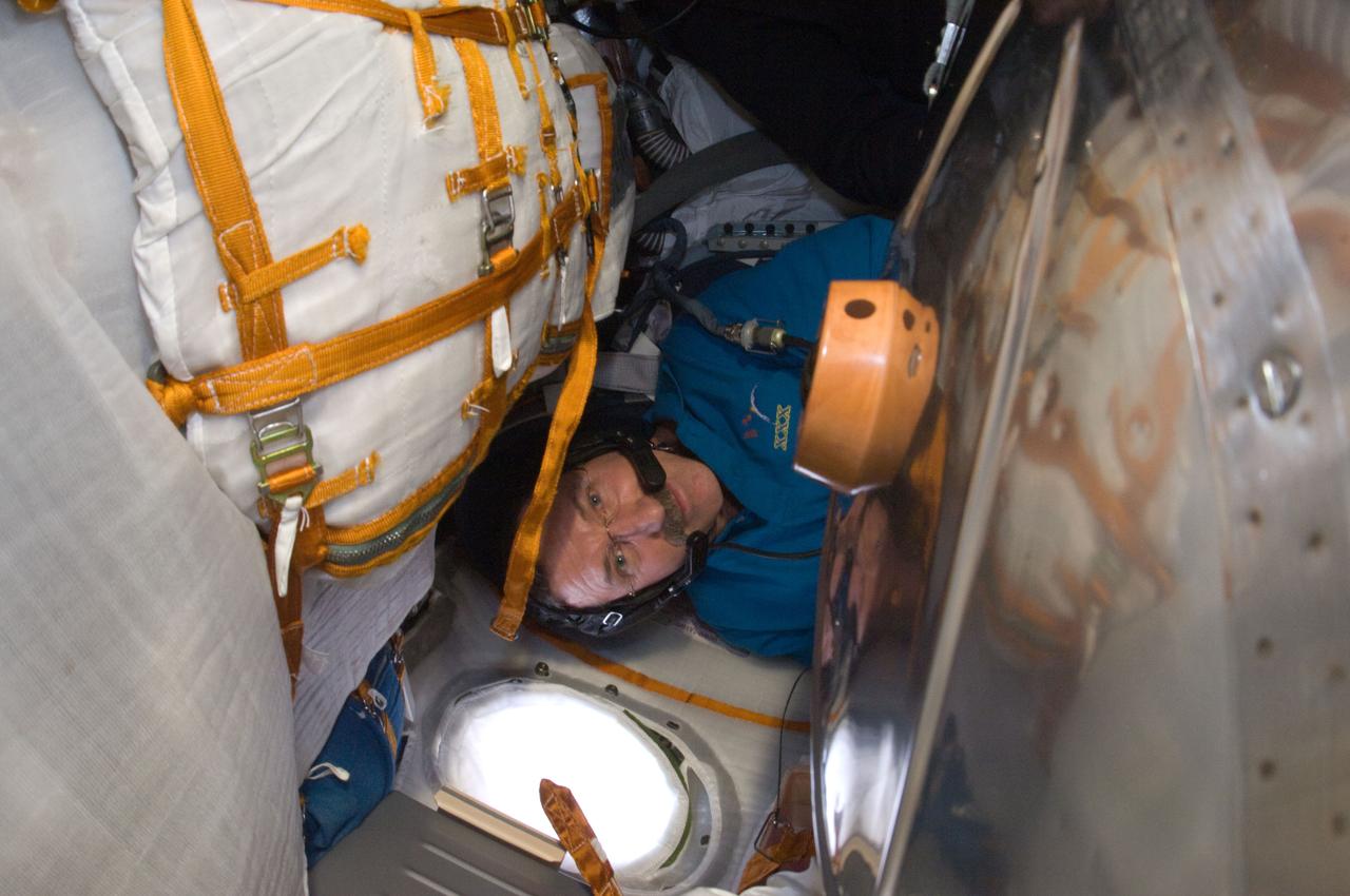 ISS030-E-247135 (23 April 2012) --- NASA astronaut Dan Burbank, Expedition 30 commander, participates in a standard onboard training exercise in the Soyuz TMA-22 descent module currently docked with the International Space Station. Burbank, along with Russian cosmonauts Anton Shkaplerov and Anatoly Ivanishin are scheduled to undock from the station and return to Earth on April 27, 2012.