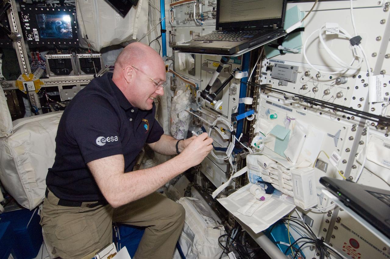 ISS030-E-257690 (26 April 2012) --- European Space Agency astronaut Andre Kuipers, Expedition 30 flight engineer, prepares for IMMUNE venous blood sample draws in the Columbus laboratory of the International Space Station. Following the blood draws, the samples were temporarily stowed in the Minus Eighty Laboratory Freezer for ISS 1 (MELFI-1) and later packed together with saliva samples on the Soyuz TMA-22 for return to Earth for analysis.