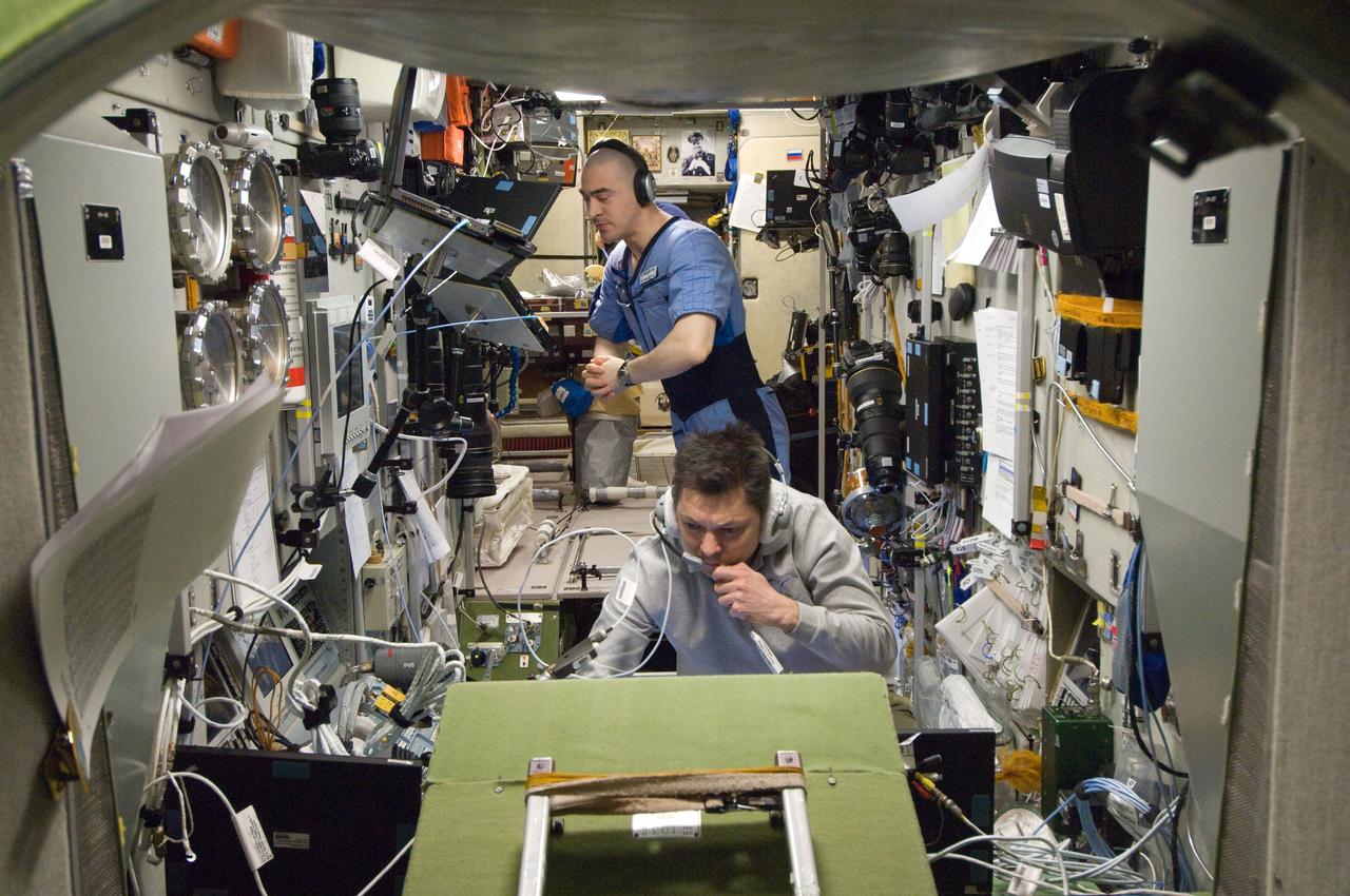 ISS030-E-267685 (22 April 2012) --- Russian cosmonauts Oleg Kononenko (foreground) and Anatoly Ivanishin, both Expedition 30 flight engineers, monitor data in the Zvezda Service Module of the International Space Station during approach and docking operations of the unpiloted ISS Progress 47 resupply vehicle. Progress 47 docked automatically to the Pirs Docking Compartment via the Kurs automated rendezvous system at 10:39 a.m. (EDT) on April 22, 2012.
