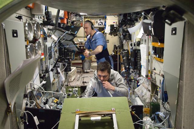 NASA image: Expedition 30 Crewmembers Monitor Data in the SM during Approach