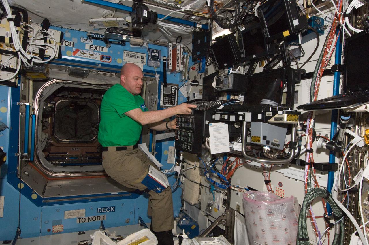 ISS030-E-267769 (24 April 2012) --- European Space Agency astronaut Andre Kuipers, Expedition 30 flight engineer, works at a robotic workstation in the Destiny laboratory of the International Space Station.