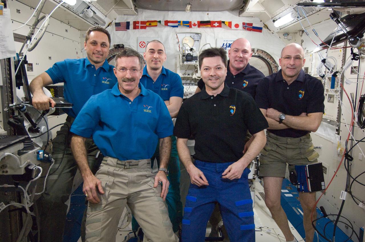 ISS030-E-267843 (25 April 2012) --- Expedition 29/30 and Expedition 30/31 crew members pose for a group portrait in the International Space Station's Kibo laboratory following the ceremony of Changing-of-Command from Expedition 30 to Expedition 31. Pictured on the front row are NASA astronaut Dan Burbank (left), Expedition 30 commander, and Russian cosmonaut Oleg Kononenko, Expedition 31 commander. Pictured on the back row (from the left) are Russian cosmonauts Anton Shkaplerov and Anatoly Ivanishin, both Expedition 30 flight engineers; European Space Agency astronaut Andre Kuipers and NASA astronaut Don Pettit, both Expedition 31 flight engineers.